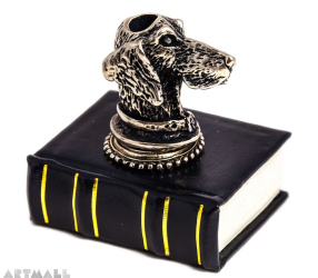 Metal decorated penstand on book reproduction. DOG